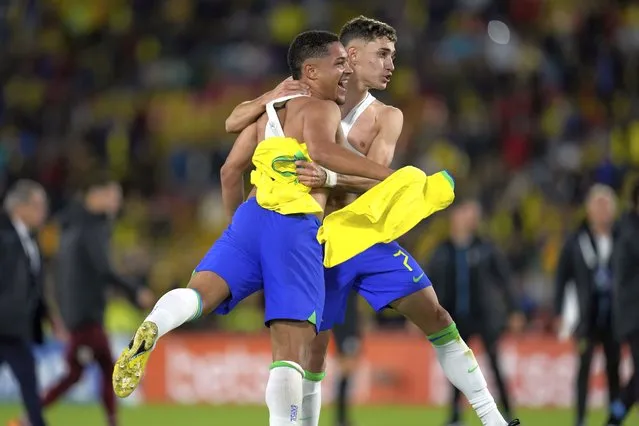 Brazil's Vitor Roque, left, and Stenio celebrate at the end of a South America U-20 soccer match against Uruguay in Bogota, Colombia, Sunday, February 12, 2023. Brazil won /2-0. (Photo by Fernando Vergara/AP Photo)