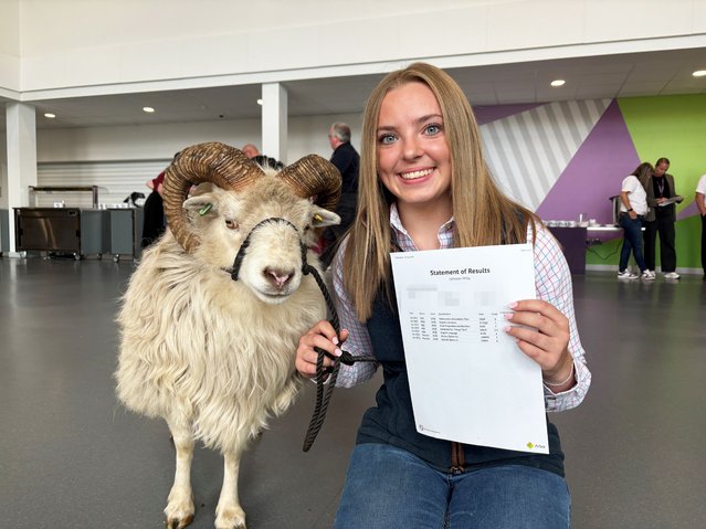 Milly Johnson, 16, and her sheep Kevin receiving her GCSE results at Tarleton Academy near Preston, Lancashire, UK on Thursday, August 21, 2025. Hundreds of thousands of pupils in England, Wales and Northern Ireland are receiving grades to help them progress to sixth form, college or training. (Photo by Eleanor Barlow/PA Wire)