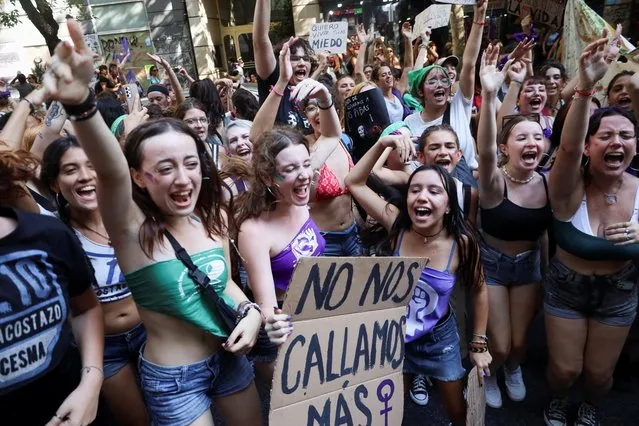 Demonstrators take part in a rally to mark the International Women's Day in Buenos Aires, Argentina on March 8, 2023. (Photo by Cristina Sille/Reuters)