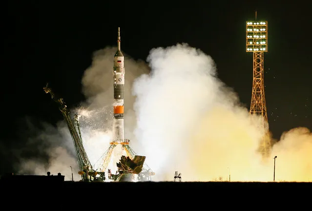 The Soyuz MS-08 spacecraft carrying the crew formed of astronauts Drew Feustel and Ricky Arnold of the U.S and crewmate Oleg Artemyev of Russia blasts off to the International Space Station (ISS) from the launchpad at the Baikonur Cosmodrome, Kazakhstan March 21, 2018. (Photo by Shamil Zhumatov/Reuters)