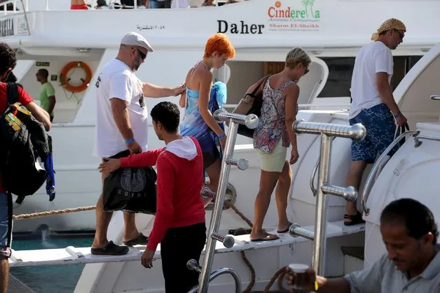 Tourists board a yacht for an excursion at a small port of the Red Sea resort of Sharm el-Sheikh, November 7, 2015. (Photo by Asmaa Waguih/Reuters)