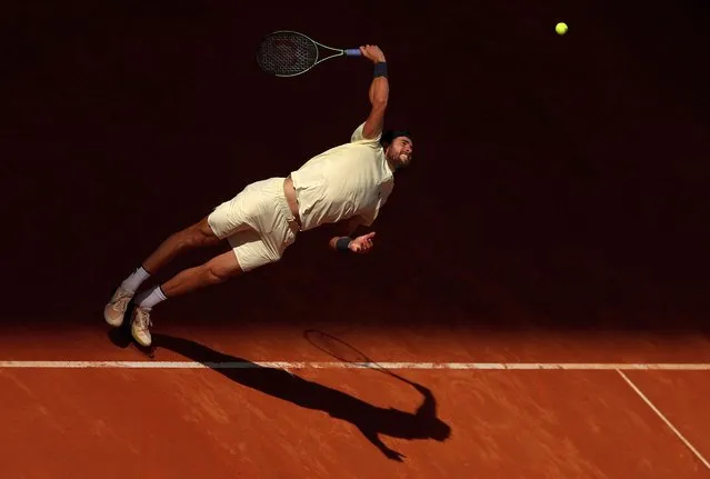 Karen Khachanov serves to Carlos Alcaraz of Spain during the Men's Singles Quarter-Final match on Day Ten of the Mutua Madrid Open at La Caja Magica on May 03, 2023 in Madrid, Spain. (Photo by Julian Finney/Getty Images)