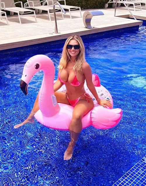 English model, television personality and former beauty queen Christine McGuinness almost bursts out of her bikini on inflatable flamingo on holiday in the second decade of May 2023. (Photo by Instagram)