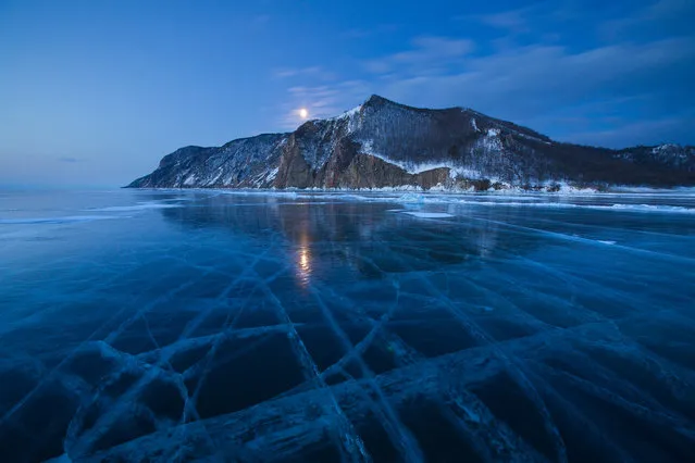 “Uzury/Ice tracery”. Russia, Baikal lake, Olkhon island, near the small settlement Uzury (Uzu:ri). This name spells almost like russian word “uzory” (uzo:ri), one of the meanings is “tracery” – the tracery of Baikal ice, cleanest in the world. March, early morning, –25C. (Photo and caption by Alexey Kharitonov/National Geographic Traveler Photo Contest)