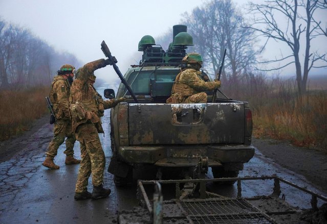 Servicemen of the 93rd Kholodnyi Yar Separate Mechanized Brigade of the Ukrainian Armed Forces load in a pickup truck after a combat mission, amid Russia's attack on Ukraine, near the frontline town of Kostiantynivka in Donetsk region, Ukraine on November 27, 2025. (Photo by Reuters/Stringer)