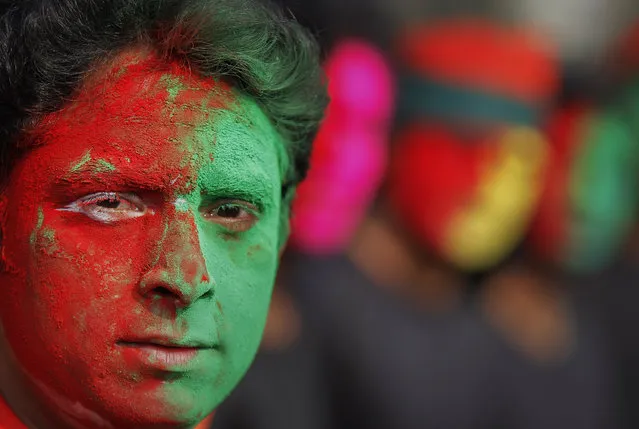 A Bangladeshi man painted his face with the color of Bangladesh’s National flag participates in a rally to mark the Victory Day in Dhaka, Bangladesh, Wednesday, December 16, 2015. The Victory Day celebrated on December 16 marks the anniversary of Bangladesh's victory in the India-aided war against Pakistan. (Photo by A.M. Ahad/AP Photo)