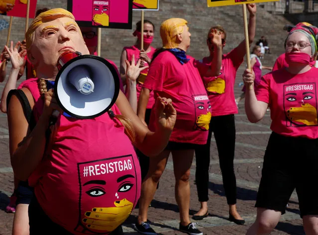 People depicting pregnant U.S. president Donald Trump attend a protest at Senate Square to support women's reproductive rights, during the U.S. President Donald Trump and Russian President Vladimir Putin summit in Helsinki, Finland July 16, 2018. (Photo by Ints Kalnins/Reuters)