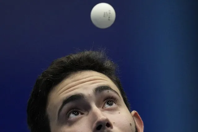 Puerto Rico's Brian Afanador competes in the men's table tennis singles final round against Cuba's Andy Pereira at the Central American and Caribbean Games in San Salvador, El Salvador, Tuesday, June 27, 2023. (Photo by Arnulfo Franco/AP Photo)