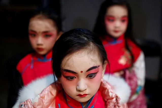 Participants wait backstage during a traditional Chinese opera competition at the National Academy of Chinese Theatre Arts in Beijing, China, November 26, 2016. (Photo by Thomas Peter/Reuters)