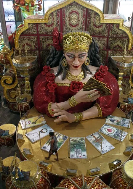 A worker reviews a carnival float at the Grande Rio samba school, in preparation for the annual carnival parade, in Rio de Janeiro February 10, 2015. (Photo by Pilar Olivares/Reuters)