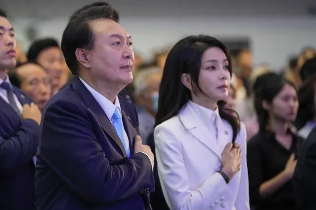 South Korean President Yoon Suk Yeol, left, and his wife Kim Keon Hee react during a ceremony to celebrate the 78th anniversary of the Korean Liberation Day from Japanese colonial rule in 1945, in Seoul, South Korea, Tuesday, August 15, 2023. (Photo by Lee Jin-man/Pool via AP Photo)