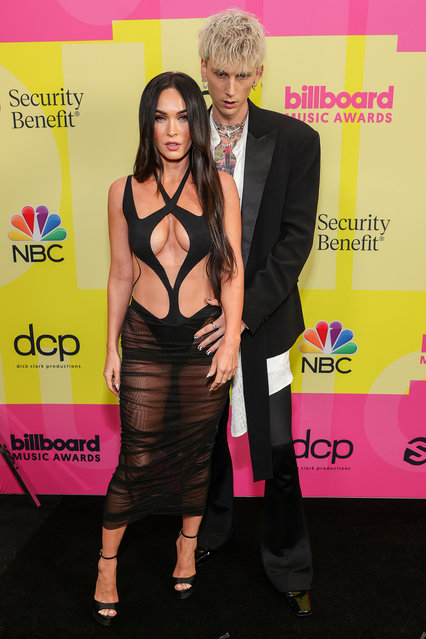 American actress and model Meghan Fox and American rapper Machine Gun Kelly poses backstage for the 2021 Billboard Music Awards, broadcast on May 23, 2021 at Microsoft Theater in Los Angeles, California. (Photo by Rich Fury/Getty Images for dcp)