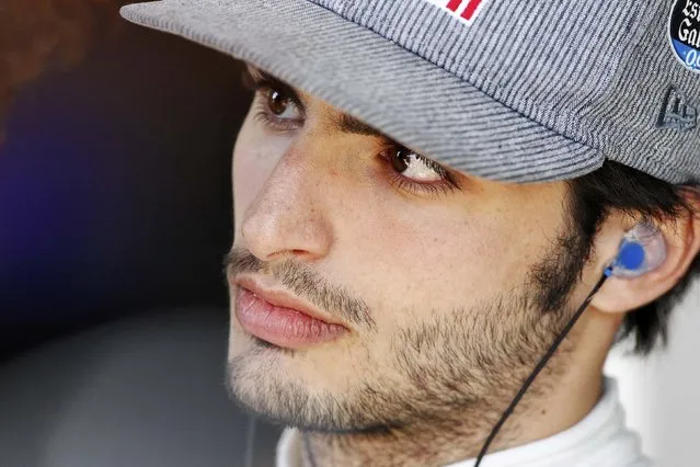 Toro Rosso Formula One driver Carlos Sainz of Spain looks on during the second practice session of the Australian F1 Grand Prix at the Albert Park circuit in Melbourne March 13, 2015. REUTERS/Brandon Malone