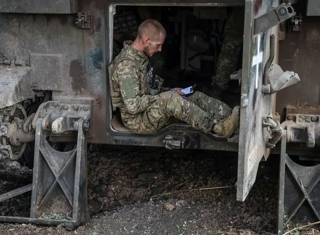 A Ukrainian servicemen seats inside a M109 self-propelled howitzer as he prepares to fire towards Russian troops in Donetsk region, Ukraine on September 22, 2023. (Photo by Oleksandr Ratushniak/Reuters)