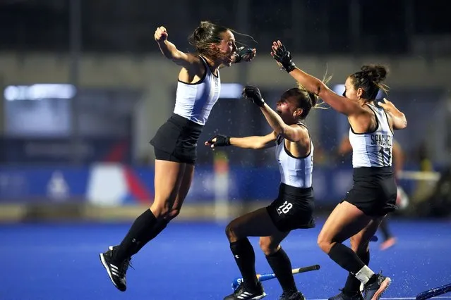 Argentina's Eugenia Trinchinetti, left, celebrates scoring against the United States, with teammates Rocio Sanchez, right, and Victoria Sauze, during the women's field hockey gold medal match, at the Pan American Games in Santiago, Chile, Saturday, November 4, 2023. (Photo by Dolores Ochoa/AP Photo)