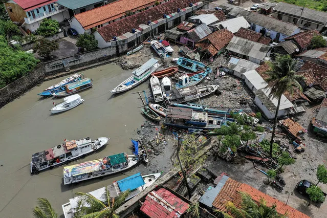Stranded boats are seen near houses after a tsunami hit at Anyer in Banten, Indonesia, December 24, 2018 in this photo taken by Antara Foto. (Photo by Muhammad Adimaja/Antara Foto via Reuters)