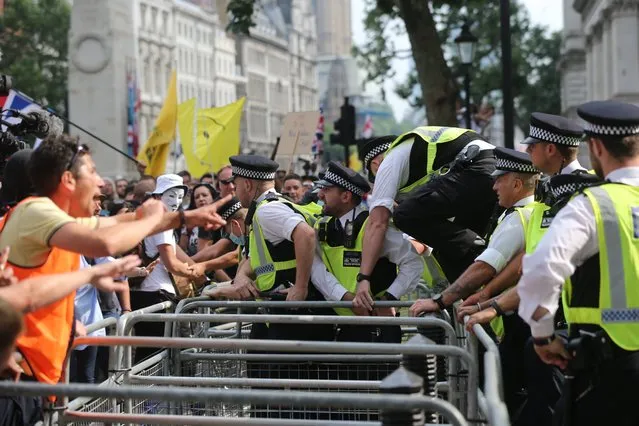 Covid deniers clash with police in Trafalgar Square during an anti-COVID demonstration, amid the coronavirus disease (COVID-19) pandemic, in London, Britain July 24, 2021. (Photo by i-Images)