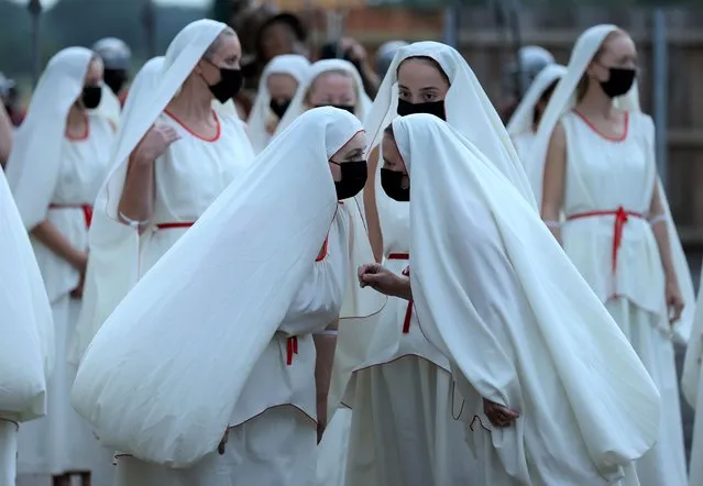 Actors perform in the opening night of “Kynren”, an outdoor live performance, after it was postponed due to coronavirus disease (COVID-19) pandemic, in Bishop Auckland, Britain on August 7, 2021. (Photo by Lee Smith/Reuters)