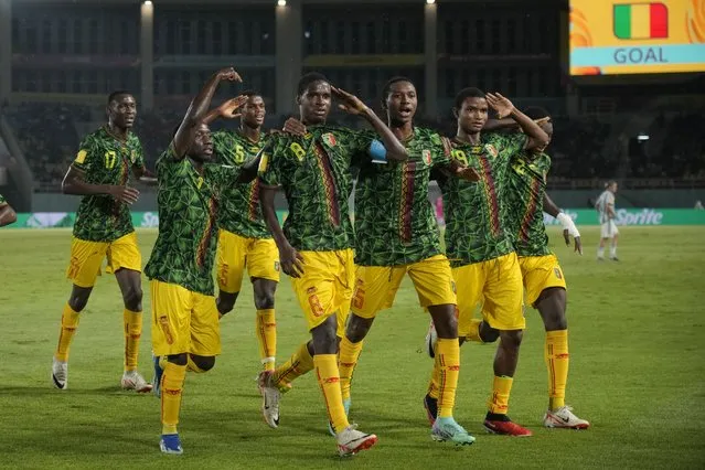 Mali's Ibrahim Diarra, 8, celebrates with his teammates after scoring the opening goal for their team during the U-17 World Cup third place playoff soccer match between Mali and Argentina at Manahan Stadium in Surakarta, Indonesia, Friday, December 1, 2023. (Photo by Achmad Ibrahim/AP Photo)