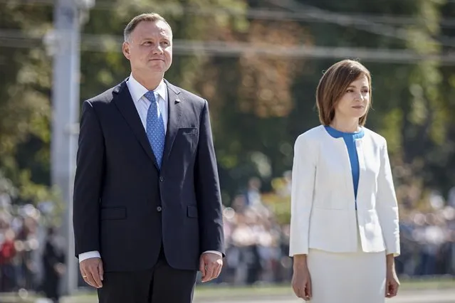 Poland's President Andrzej Duda, left, and Moldova's President Maia Sandu stand during an event held to celebrate Moldova's national day, three decades after the country declared independence from the Soviet Union, in Chisinau, Moldova, Friday, August 27, 2021. (Photo by Aurel Obreja/AP Photo)