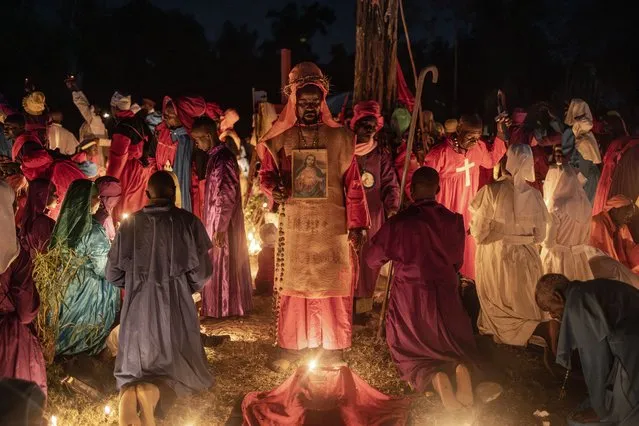 Worshippers of the Legio Maria African Church Mission gather to pray during the Christmas Eve vigil mass in a church near Ugunja, on December 24, 2023. Legio Maria is an African independent religious movement that developed gradually and eventually separated from the Roman Catholic Church in the 1960s. The religious movement was initiated by repeated appearances of a mystic woman delivering messages about the incarnation of the Son of God as a black man. (Photo by Luis Tato/AFP Photo)