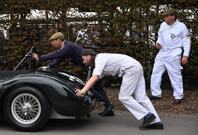 Motoring enthusiasts attend the Goodwood Revival, a three-day historic car racing festival in Goodwood, Chichester, southern Britain, September 17, 2021. (Photo by Toby Melville/Reuters)