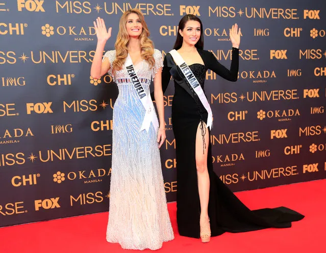 Miss Universe candidates Mariam Habach of Venezuela and Dang Thi Le Hang of Vietnam pose for a picture during a red carpet inside a SMX convention in metro Manila, Philippines January 29, 2017. (Photo by Romeo Ranoco/Reuters)