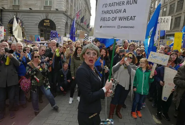 A Theresa May impersonator seen during the Put It To The People March as estimates of over a million people attended the March, organised by the campaign for a People's Vote, from Park Lane to Parliament Square, calling for a public vote on the Government's final Brexit deal on March 23, 2019 in London, England. (Photo by Andy Hall/The Observer)