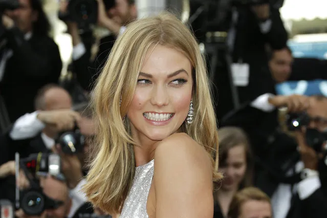 Karlie Kloss arrives for the opening ceremony and the screening of the film La Tete Haute (Standing Tall) at the 68th international film festival, Cannes, southern France, Wednesday, May 13, 2015. (Photo by Joel Ryan/Invision/AP Photo)