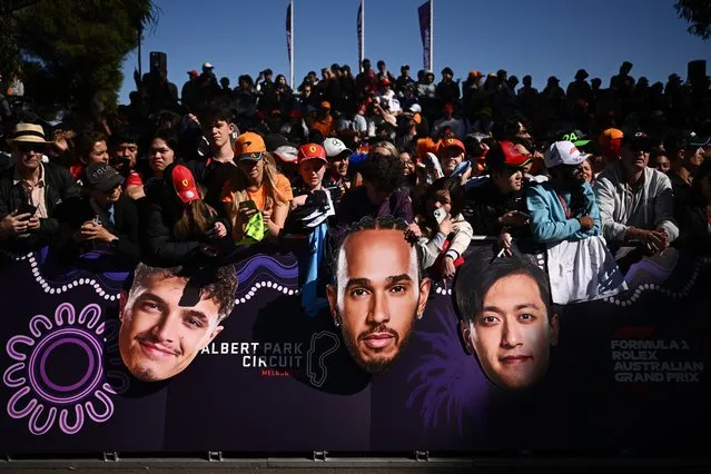 Fans wait for F1 drivers to arrive at the Albert Park Grand Prix Circuit in Melbourne, Australia, 21 March 2024. The 2024 Australia Formula 1 Grand Prix is held on 24 March. (Photo by Joel Carrett/EPA)