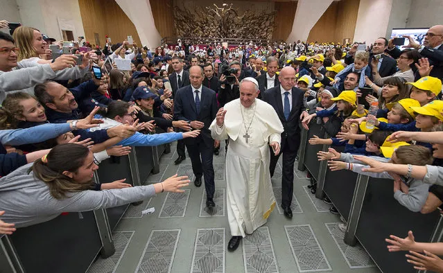 Pope Francis arrives for an audience with a group of children in the Paul VI hall at the Vatican, Monday, May 11, 2015. (Photo by L'Osservatore Romano/AP Photo/Pool Photo)