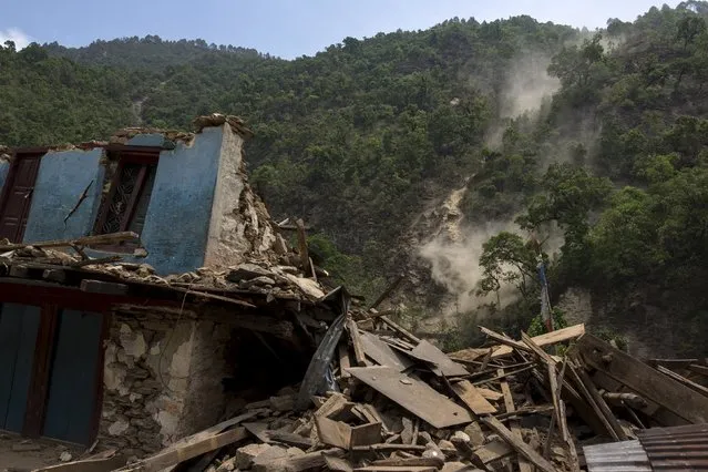 A collapsed house is pictured during a landslide after Tuesday's earthquake at Singati Village, in Dolakha, Nepal, May 15, 2015. (Photo by Athit Perawongmetha/Reuters)