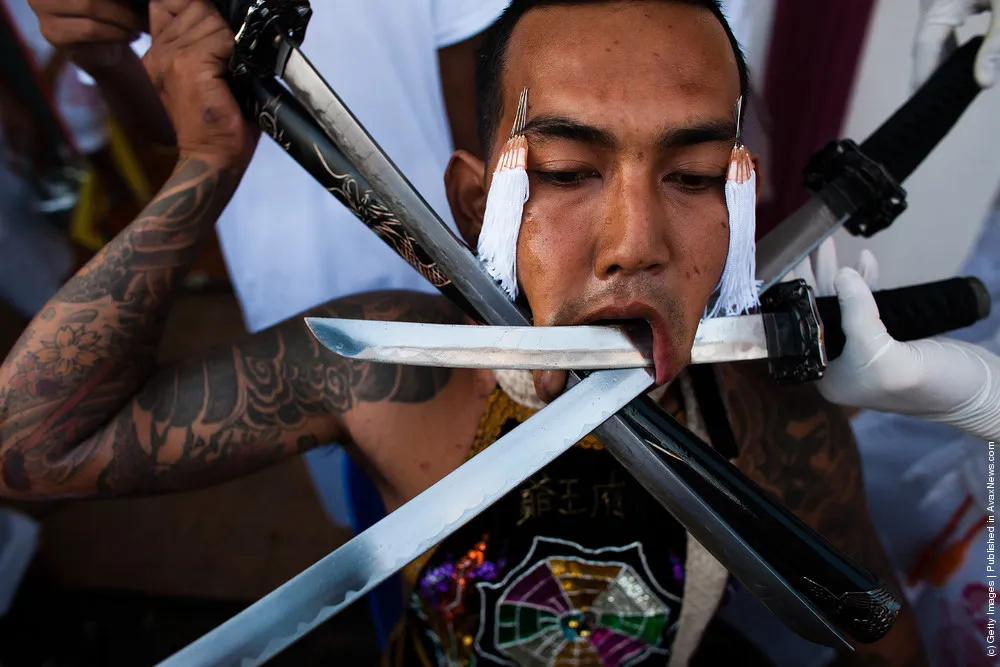 Devotees Practice Self Mutilation At Phuket Vegetarian Festival