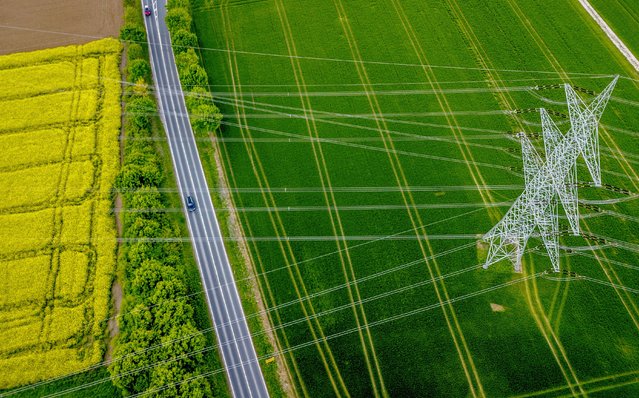 A power pole stands on a field in the outskirts of Frankfurt, Germany, Thursday, April 25, 2024. (Photo by Michael Probst/AP Photo)