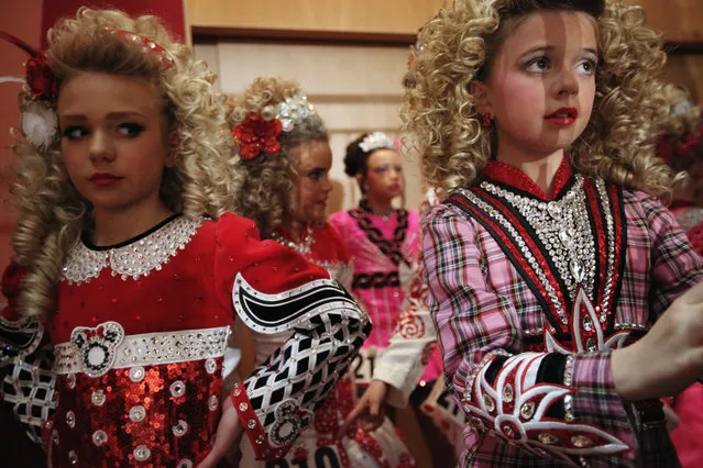 Competitors in the 11/12 Girls  Ceili Category wait to perform backstage at the World Irish Dance Championship on April 13, 2014 in London, England. The 44th World Irish Dance Championship is currently running at London's Hilton London Metropole hotel, and will host approximately 5,000 dancers competing in solo, Ceili, modern figure choreography and dance drama categories during the week long event. (Photo by Dan Kitwood/Getty Images)