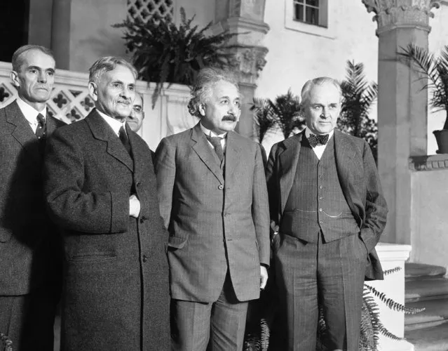 In this distinguished group which met in Pasadena, Calif., on January 10, 1931  to discuss scientific problems are, left to right: Walter S. Adams, astronomer and director of the Mt. Wilson Carnegie observatory; Dr. Albert A. Michelson, formerly of Chicago University, who measured the speed of light; Dr. Albert Einstein, famed for his theory of relativity; and Dr. Robert A. Millikan, president of the California Institute and discoverer of the cosmic ray. The latter three have been awarded the Nobel Prize. (Photo by AP Photo)
