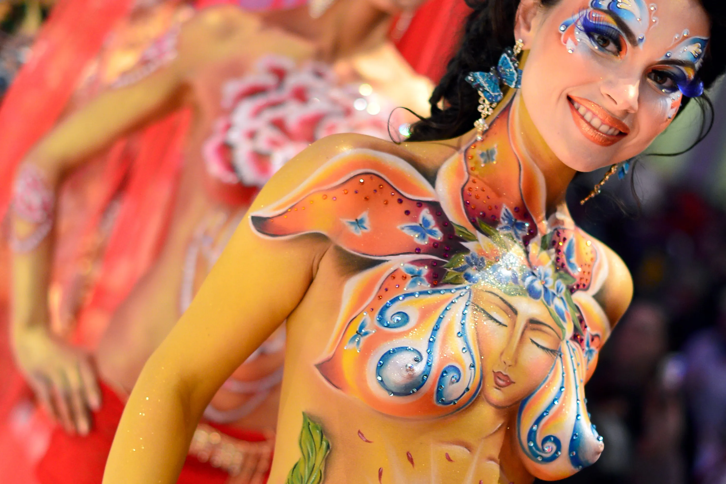 Next picture →. A model poses after the contest "Body Painting" o...