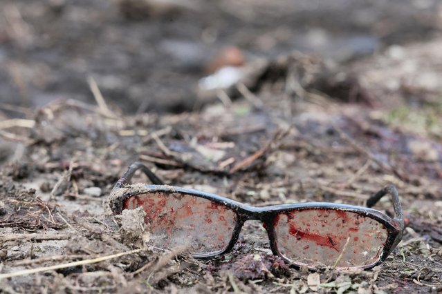 A view shows a pair of glasses with blood on them, in the aftermath of deadly shelling of residential buildings, as Russia's invasion of Ukraine continues, in Kostiantynivka, Ukraine on April 2, 2023. (Photo by Violeta Santos Moura/Reuters)