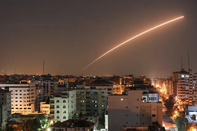 Israeli missile launched from the Iron Dome defence missile system, designed to intercept and destroy incoming short-range rockets and artillery shells, is seen above Gaza city on November 12, 2019. (Photo by Bashar Taleb/AFP Photo)