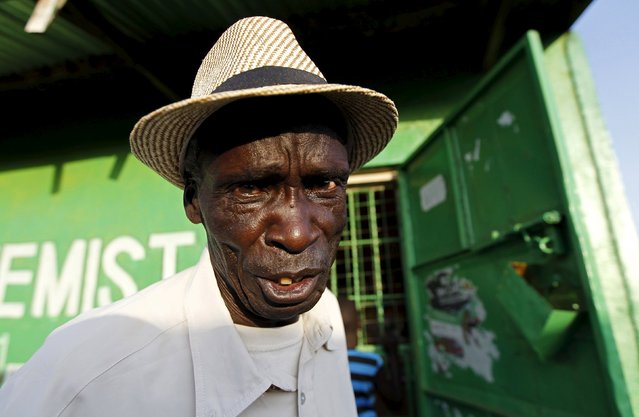 Malachi Obondu, 70, poses for a photograph in the trading centre of Kogelo, west of Kenya's capital Nairobi, July 14, 2015. Obondu said, “When I see U.S. President Barack Obama, he reminds me of the gallant nature of his father Barack Obama Senior. He was a sharp and smart young man who never shied away from any matter in the society”. “With Obama's homecoming, we expect prosperity within the country and in Kogelo, we will hope for the things that we have missed like having a university in Kogelo”, he added. (Photo by Thomas Mukoya/Reuters)