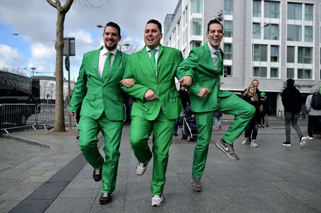 Revellers attend the Saint Patrick's Day parade on March 17, 2019 in Dublin, Ireland. Saint Patrick, the patron saint of Ireland is celebrated around the world on St. Patrick's Day. According to legend Saint Patrick used the three-leaved shamrock to explain the Holy Trinity to Irish pagans in the 5th-century after becoming a Christian missionary. (Photo by Charles McQuillan/Getty Images)