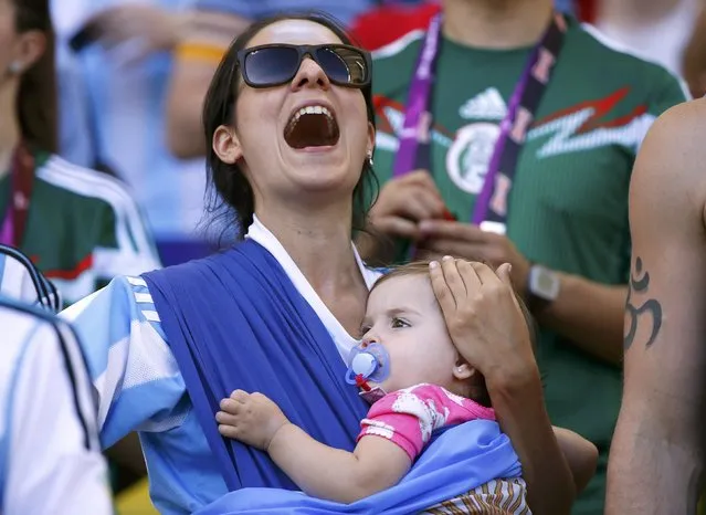 A fan cheers before the 2014 World Cup final between Germany and Argentina at the Maracana stadium in Rio de Janeiro July 13, 2014. (Photo by Damir Sagolj/Reuters)