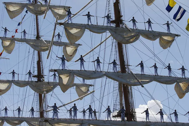 Mexican Navy crew stand on the sails of the ARM Cuauhtemoc sailing ship as it prepares to dock in the South Harbor for a five-day goodwill visit Friday, August 4, 2017, in Manila, Philippines. (Photo by Bullit Marquez/AP Photo)