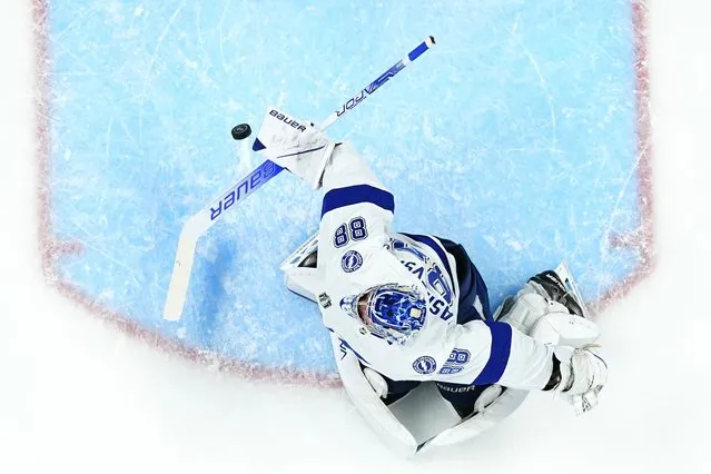 Tampa Bay Lightning goaltender Andrei Vasilevskiy (88) makes a save against the Colorado Avalanche during the first period in Game 5 of the NHL Stanley Cup Final on Friday, June 24, 2022, in Denver. (Photo by Jack Dempsey/AP Photo)
