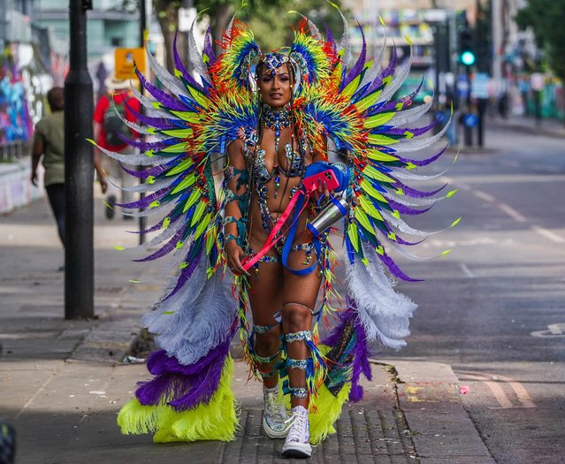 Participants in feathered costumes representing birds of the tropics taking part in the carnival parade in London, United Kingdom on August 28, 2023. The Notting Hill Carnival is Europe's largest street festival, which celebrates Caribbean culture, is expected to attract over 1 million revellers on bank holiday monday. (Photo by Amer Ghazzal/Rex Features/Shutterstock)