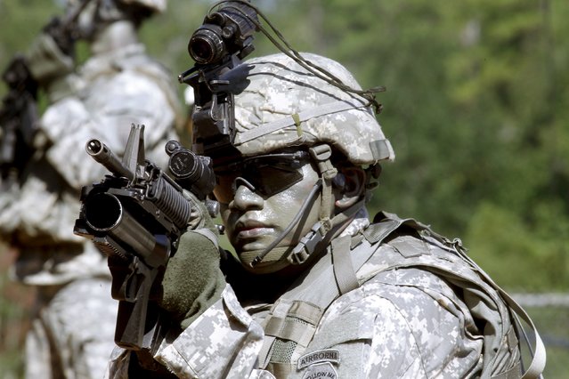 A U.S. Army Ranger shows skills during a demonstration at Ranger school graduation at Fort Benning in Columbus, Georgia August 21, 2015. (Photo by Tami Chappell/Reuters)