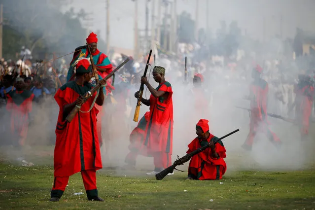 Palace guards fire locally-made muskets during the durbar festival on the second day of Eid-al-Fitr celebrations in Nigeria's northern city of Kano, July 7, 2016. The Durbar festival begins with prayers, followed by a parade of the Emir and his entourage on horses, accompanied by music players, and ending at the Emir's palace. The Durbar festival had been in hausaland for more than 500 years. (Photo by Akintunde Akinleye/Reuters)