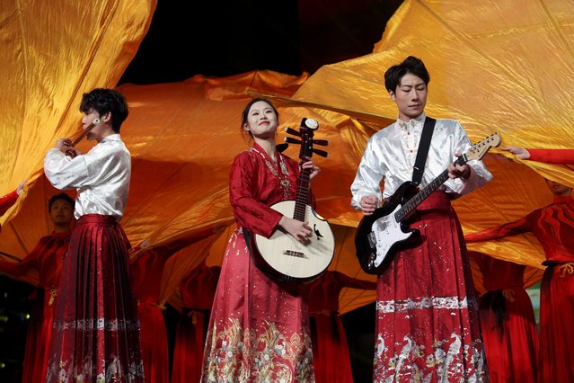 Performers take part in a countdown celebration event for New Year's Eve, at Shougang Park in Beijing, China, on December 31, 2024. (Photo by Florence Lo/Reuters)