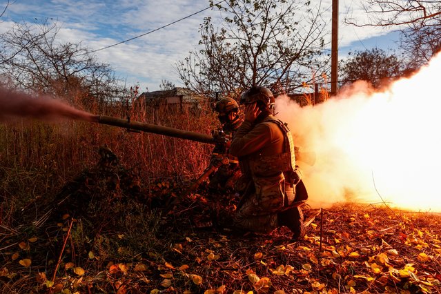 Ukrainian forces fire a SPG-9 anti-tank grenade launcher at Russian troops in the city of Avdiyivka in eastern Ukraine on November 8, 2023. Russian troops have been attempting for several weeks to encircle the industrial city but have met fierce Ukrainian resistance. (Photo by Serhiy Nuzhnenko/Radio Free Europe/Radio Liberty)