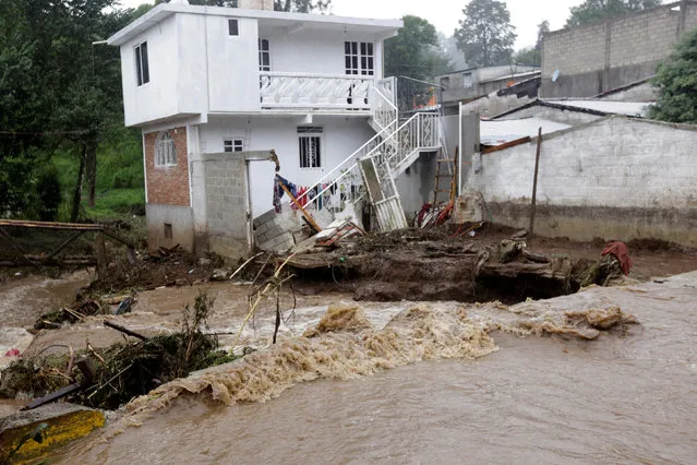 A house damaged after a river overflowed its banks following heavy showers caused by the passing of Tropical Storm Earl, in the town of Huauchinango, in Puebla state, Mexico, August 7, 2016. (Photo by Reuters/Stringer)